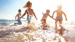 © LiezDesign - Group of children playing on beach and splashing in the ocean waves.
