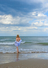 Wall Mural - Natural woman's beauty concept. Lady at the beach in romantic feminine style