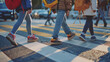 © LiezDesign - Close-up of schoolchildren safely crossing the street at a marked pedestrian crossing on their way to school.