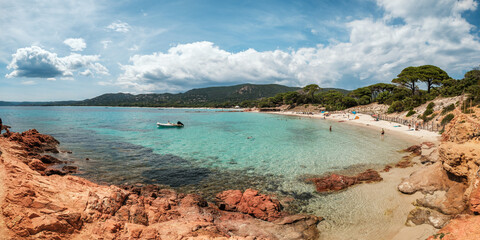 Sticker - Holidaymakers enjoying the sun, sand and azure Mediterranean sea at Palombaggia beach on the south east coast of the island of Corsica