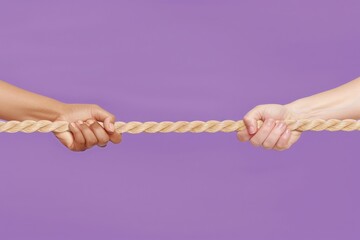 Two hands grip a thick rope, pulling in opposite directions against a vibrant purple backdrop. The tension is palpable, and the outcome of this tug-of-war is uncertain.