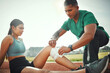 © DavisShared/peopleimages.com - Athletics, sports and people with bandage of injury for training, first aid or leg support on track. Field, runner and paramedic with wrap for outdoor exercise accident, sprain or protection of joint