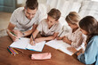 © Chanelle2000/peopleimages.com - Family, kids and writing for homework in home for education, learning and support with care. Parents, people and school work with teaching for child development or growth art project and creativity