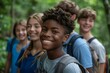 © Yuliia - group of teenagers laughing and smiling while hiking and exploring the outdoors in the summer, showcasing their active and social lifestyle.