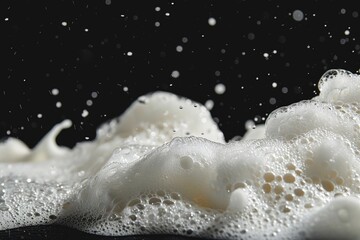 Aufkleber - A close-up shot of foamy water on a black surface