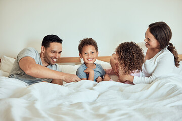 Canvas Print - Happy, family home and bed with children and parents together with laugh, game and playing in the morning. Funny, smile and bonding with love, care and support with mom and dad in bedroom with kids