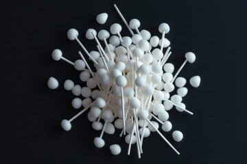 Poster - A collection of white plastic balls and pins arranged on a black surface