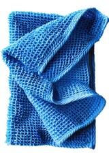 Poster - A close-up of a blue towel on a white background, suitable for use in design or photography projects