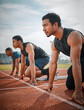 © DavisShared/peopleimages.com - Race, challenge and men at track start for speed exercise, marathon event and professional sports at arena. Ready, set and people at stadium for competition, fitness and athlete mindset for running