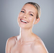 © Van Wyk/peopleimages.com - Woman, portrait and smile in studio for skincare, beauty and luxury spa treatment on gray background. Girl, happy and confidence for healthy skin, self care and wellness with facial transformation