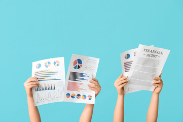 Aufkleber - female hands with financial graphics and documents on blue background