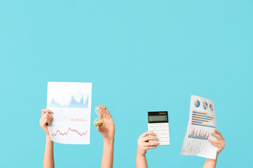 Aufkleber - female hands with financial graphics, calculator and hourglass on blue background