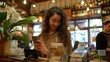 © Image Alchemy - NFC payment: Woman paying a bill with her smartphone in a cafe, Generative AI