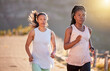 © Alex Shared/peopleimages.com - Woman, friends and running on mountain street, nature and cardio sport for fitness together. Marathon, training and wellness activity with athletic partner, friendship and race with energy for health