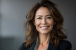 © EliteStockPhotos - Confident business woman smiling, radiating positivity and approachability. Perfect for corporate promotions, diversity campaigns, or personal branding.