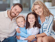 © David/peopleimages.com - Portrait, relax and family with love, girls and children with happiness, together and house. Face, parents and mother with father, embrace or weekend break with smile, cheerful or kids in lounge