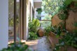 © Fotograf - A view of a patio with potted plants, suitable for use in interior design or garden planning