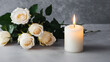 © PongSS - A white candle illuminating a delicate bouquet of white roses. The soft candlelight creates a serene and tranquil atmosphere, highlighting the beauty and purity of the flowers.