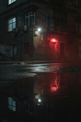 Poster - A city building with a bright red light reflected in a small puddle of water