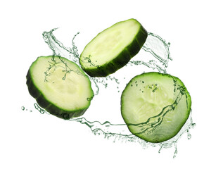 Wall Mural - Cucumber slices and splashing water in air on white background