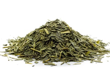 Poster - A pile of green tea leaves arranged on a clean white surface