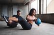 © aLListar/peopleimages.com - Exercise, couple and fitness with medicine ball outdoor for workout, balance training and core strength of performance. Active, people and muscle challenge, strong biceps and support for gym results