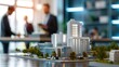 © Gambar Upi - real estate developers, architects and businessmen team working on new business buildings project in office. complex scale model on the table