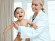 © KayJoint/peopleimages.com - Pediatrician, doctor and baby with consultation, healthcare and appointment for wellness, medicare and kid. Professional, infant and child in office, checkup and progress with examination and smile