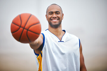 Happy man, portrait and basketball player with ball for game, match or outdoor fitness on pitch or field. Active, young male person or athlete with smile for sport, exercise or workout in nature