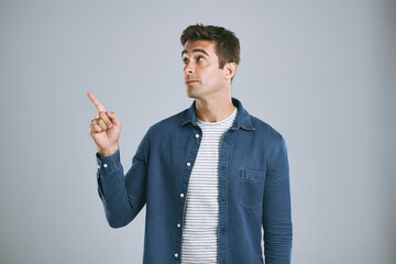 Aufkleber - Portrait, pointing and man with promotion opportunity and model on grey studio background. Face, person and guy with hand gesture, mockup space and timeline with discount deal, info and coming soon