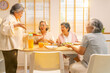 © CandyRetriever  - Group of Happy Asian senior women having dinner together at home. Elderly retired woman friends enjoy indoor lifestyle meeting party eating healthy food and vegetables salad together on dining table.