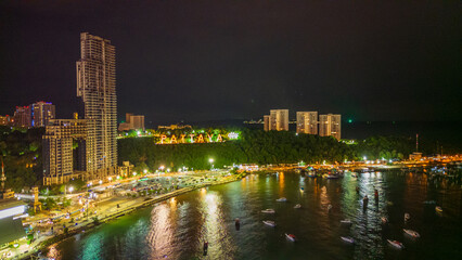 Wall Mural - aerial of Pattaya Thailand sign city illuminated at night with skyline cityscape 