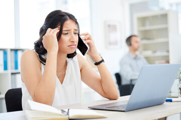 Canvas Print - Woman, cellphone and sad in office for phone call conversation, upset and bad news at desk. Laptop, stress and headache for online communication, anxiety or sales person for loss on commission