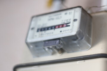Poster - Close-up view of a meter on a wall.