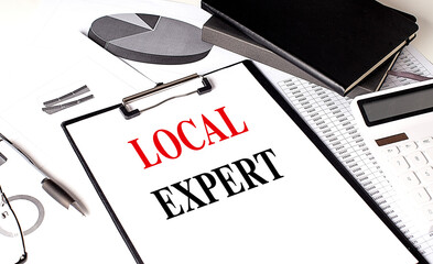 Poster - LOCAL EXPERT text on clipboard on chart with notebook and calculator