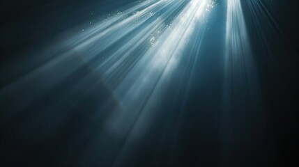 Radiant light beam glowing on a pitch-black backdrop, close-up view