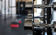 © lensw0rld - Selective focus on a row of weights in a gym