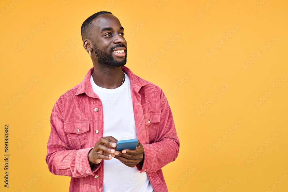 Young happy African Black man user with smartphone in hands standing ...