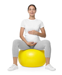 Canvas Print - Beautiful pregnant woman doing exercises on fitball against white background