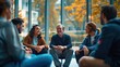 © NiK0StudeO - A group of people are sitting together in a room, smiling and laughing