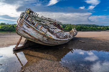 Wall Mural - walking around an old ship wreck of City Dulas Anglesey