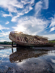 Wall Mural - walking around an old ship wreck of City Dulas Anglesey