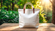 © 9KHOU - Blank white canvas tote bag mockup on a sunlit table, perfect for showcasing designs This eco-friendly product  is perfect for promoting sustainable living simple, and durable design.