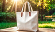 © 9KHOU - Blank white canvas tote bag mockup on a sunlit table, perfect for showcasing designs This eco-friendly product  is perfect for promoting sustainable living simple, and durable design.