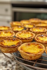 Wall Mural - Traditional Portuguese egg tart dessert Pasteis Pastel de nata on a cooling rack 