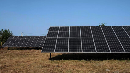 Wall Mural - Close-up of the surface of photovoltaic solar panels installed on the roof of a building to produce clean, green electricity. Manufacturing renewable energy concept.