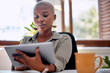 © peopleimages.com - Working, black woman and tablet with ideas as junior, intern and financial advisor in insurance company. Female person, serious and tech in office, building or firm as professional in business or job