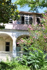 Poster - A colorful bouquet of flowers adorns the entrance of a building, adding a pop of color to the exterior.