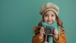 © CreativeLoom - A young girl is holding a camera and smiling