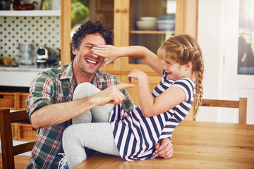 Wall Mural - Care, love and father play with child for bonding in kitchen together, excited and laughing as daughter parent. Girl, dad and weekend in home with kid, fun game and happiness for childhood memory